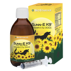 BioStar Sunn-E K9 vitamin E oil for dogs, shown with its box, 4 oz bottle and syringe