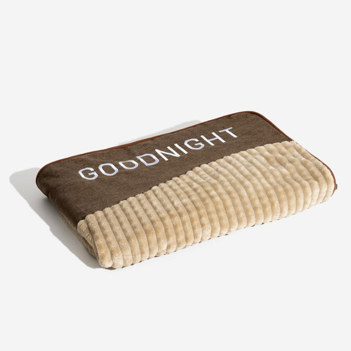 Cushioned rectangular dog bed with a soft, calming surface