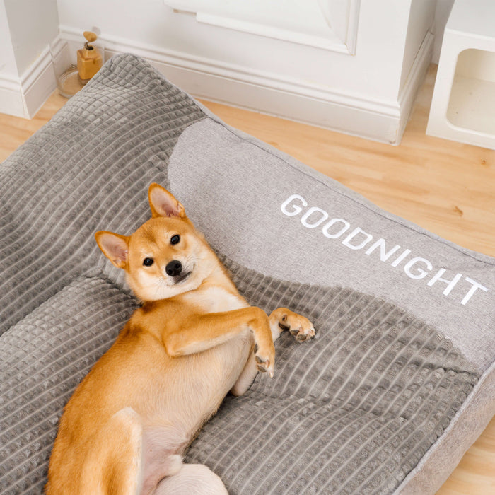 Calming cushioned rectangular indoor dog bed