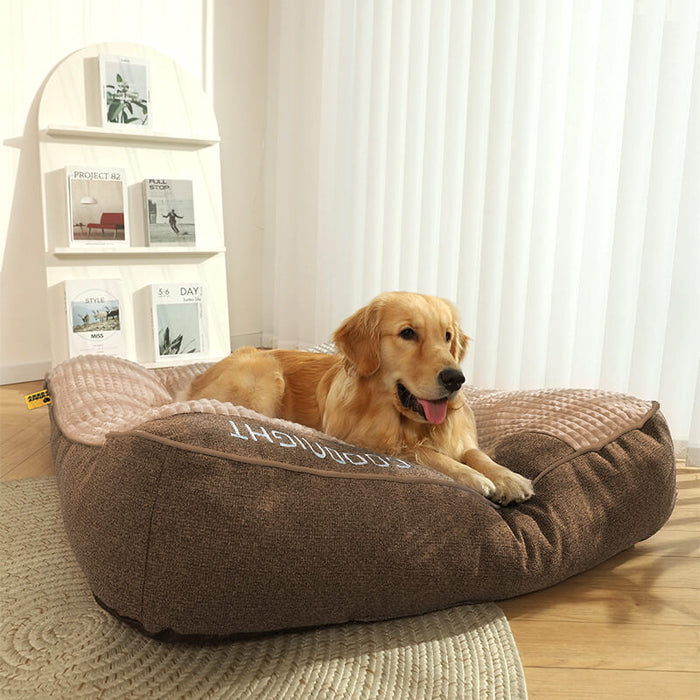 Plush indoor dog bed with bolstered, cushioned sides
