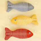 Catnip-filled plush fish cat toy with sturdy stitching for repeated play