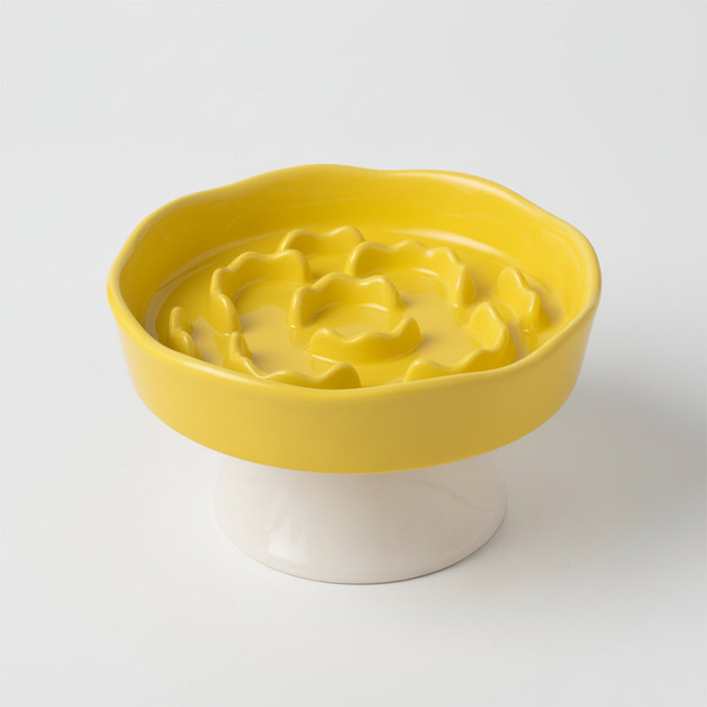 Yellow ceramic raised slow feeder bowl with a slow-feeding surface for fast eaters