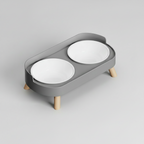 Minimalist gray elevated double bowl feeder with two plastic bowls that lift out of the stand for washing