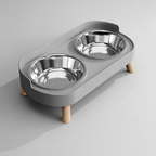 Minimalist gray elevated double bowl feeder with two stainless steel bowls that lift out of the stand for washing
