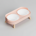 Cherry blossom pink elevated double bowl feeder with two plastic bowls on a raised ABS base for food and water