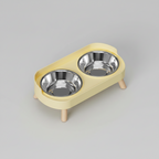Lemon yellow elevated double bowl feeder with two stainless steel bowls that lift out of the stand for washing