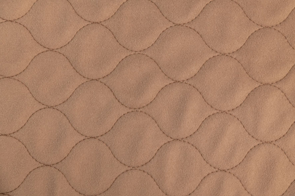 Close-up of the coffee-colored, stain-resistant brushed polyester top on an EZwhelp brown pad