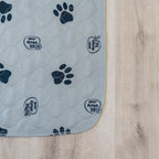 Gray EZwhelp paw print pad quilted to an absorbent soaker, with serged safety-stitched edges