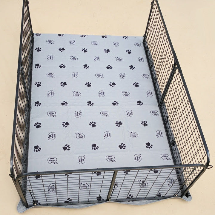 Gray EZwhelp grommet pad cut larger than the room so its edges wrap up outside the walls