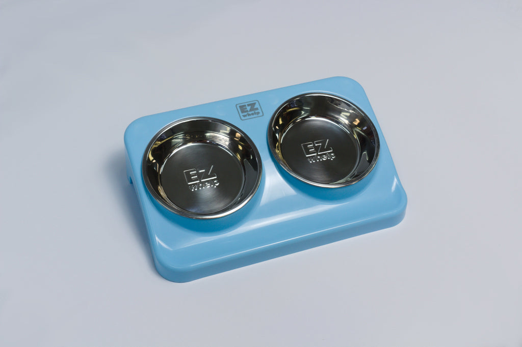 EZwhelp water and food station panel with height-adjustable dishes that lift out to clean