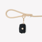 Black FURLOU poop bag holder, a cotton canvas pouch that holds one standard roll of bags