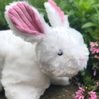 Soft white HuggleHounds Squooshie bunny dog toy with pink ears, made for carrying and cuddling