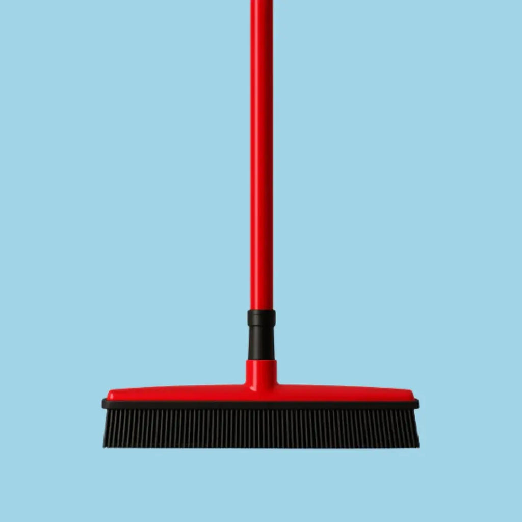 Pet hair broom lifting dog and cat fur into a collectible pile.