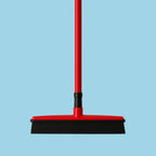 Pet hair broom lifting dog and cat fur into a collectible pile.