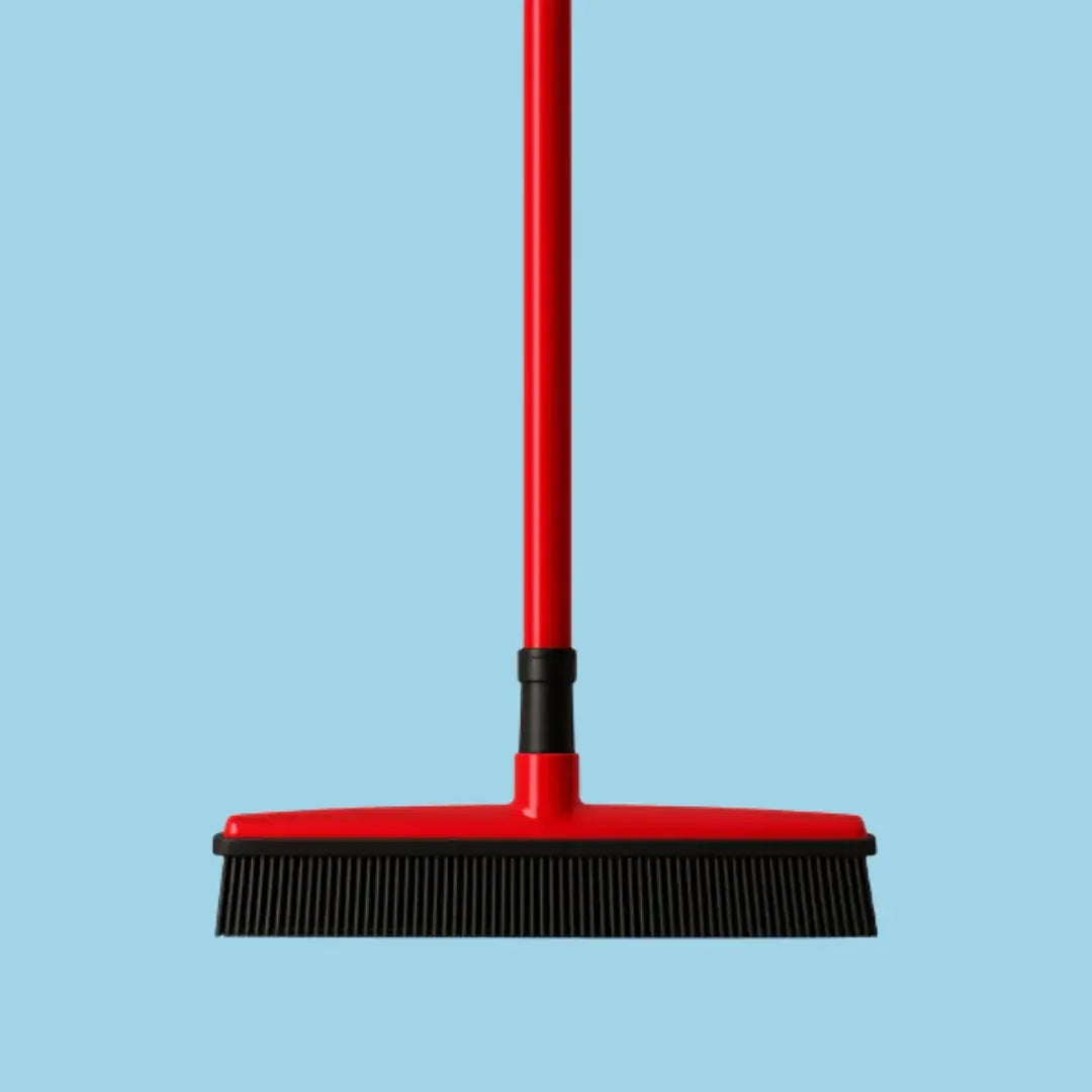 Pet hair broom lifting dog and cat fur into a collectible pile.