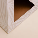 Neutral Palm Kitty Kardboard cat pyramid, a cozy cat hideaway that doubles as a decor piece for the room