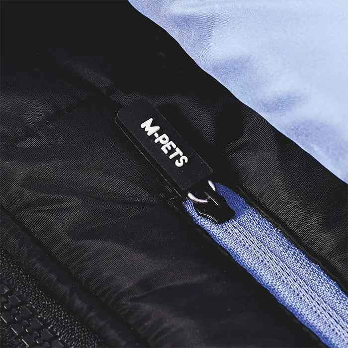 Large black and blue M-Pets Gentle dog jacket that helps keep dogs dry in snow and light rain