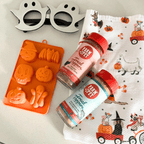 Orange Halloween mold filled with homemade treats, a SodaPup silicone mold from Farm to Pet
