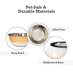 Stainless steel dog bowl with deep sides and a soft peach coral finish for the feeding area