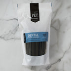 Star-shaped grain-free dental chew sticks from The Pet Gourmet that reach between dog teeth