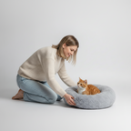 Cozy plush donut bed for pets that like to curl up and rest their head on an edge