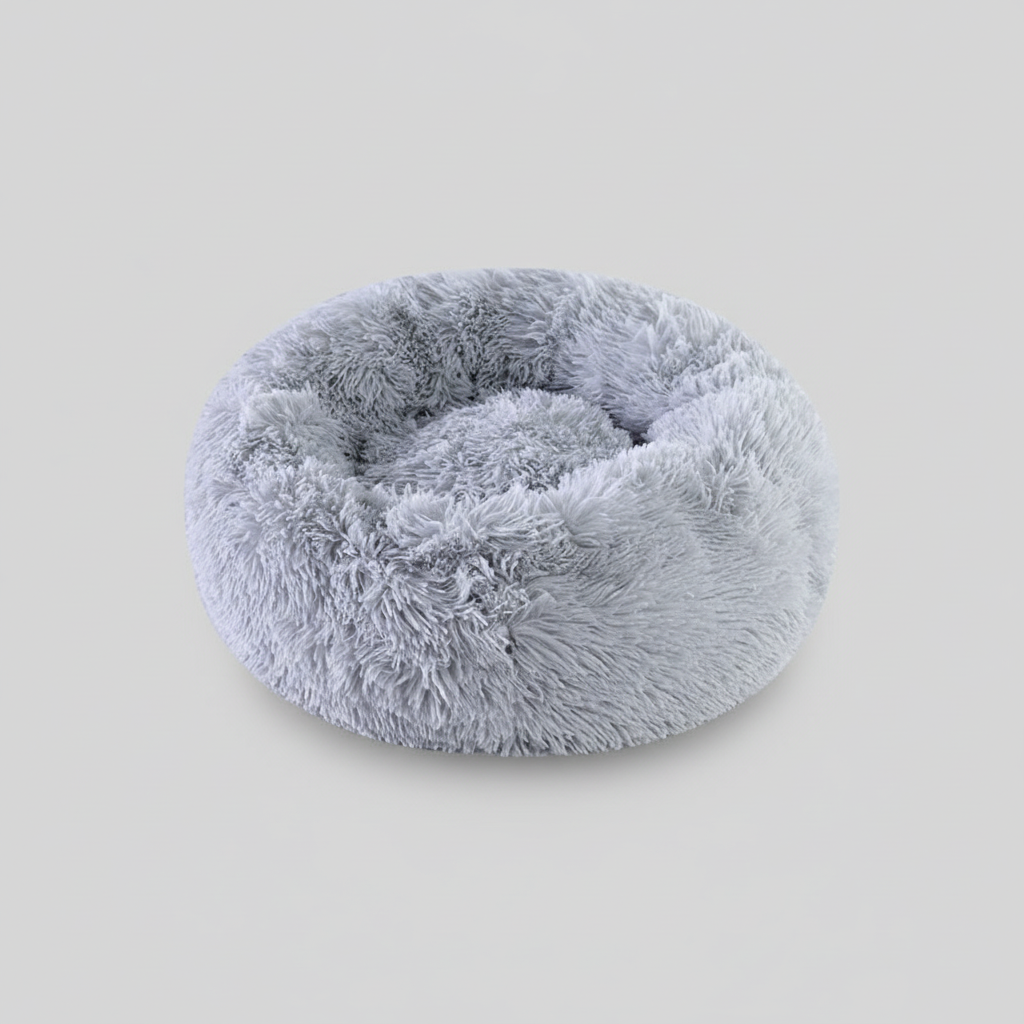 Plush donut comfort pet bed with a round shape that suits natural curling