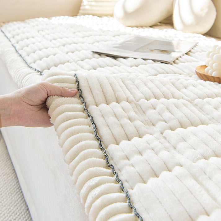 Plush furniture cover that protects sofas from pet hair