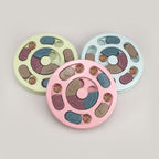 Round interactive puzzle slow feeder toy for dogs and cats with a non-slip base