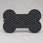 Black silicone lick mat, a BPA-free slow feeder for wet food, yogurt or peanut butter