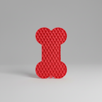 Red silicone lick mat with a raised bone pattern that holds soft food in its grooves