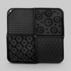 Black silicone lick mat with a suction base for spreading peanut butter or yogurt