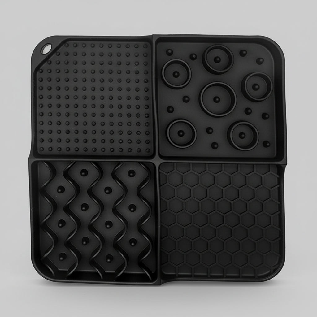 Black silicone lick mat with a suction base for spreading peanut butter or yogurt
