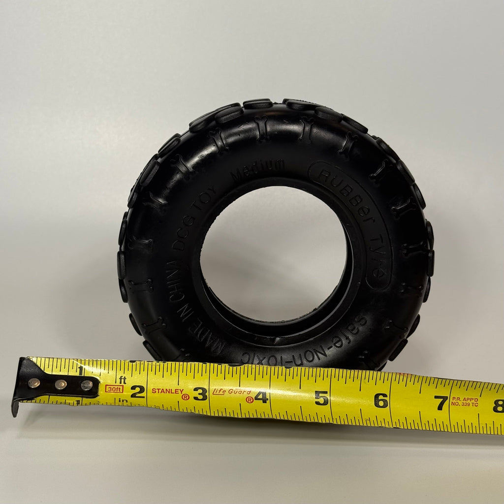 Medium Sniff and Shift dog tire toy in durable rubber, sized for dogs from 25 to 60 lbs