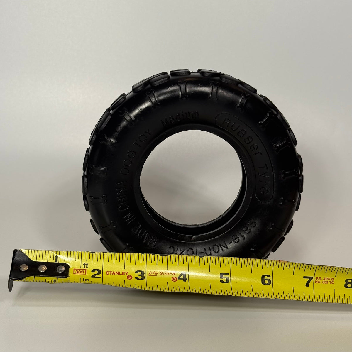 Medium Sniff and Shift dog tire toy in durable rubber, sized for dogs from 25 to 60 lbs