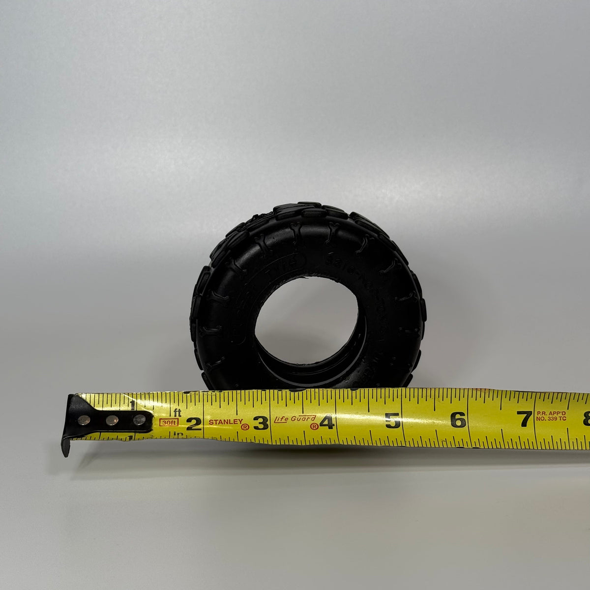 Small Sniff and Shift rubber tire toy for dogs up to 25 lbs, with a center to stuff with soft treats