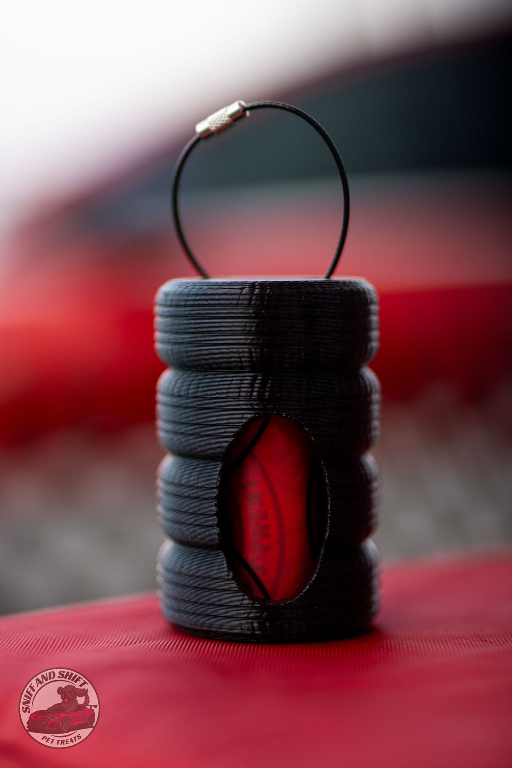 Sniff and Shift Tire Stack bag dispenser that clips to a leash with a steel screw-lock cable