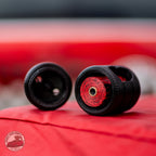 Tire Stack poop bag holder by Sniff and Shift with a roll of strawberry-scented bags inside
