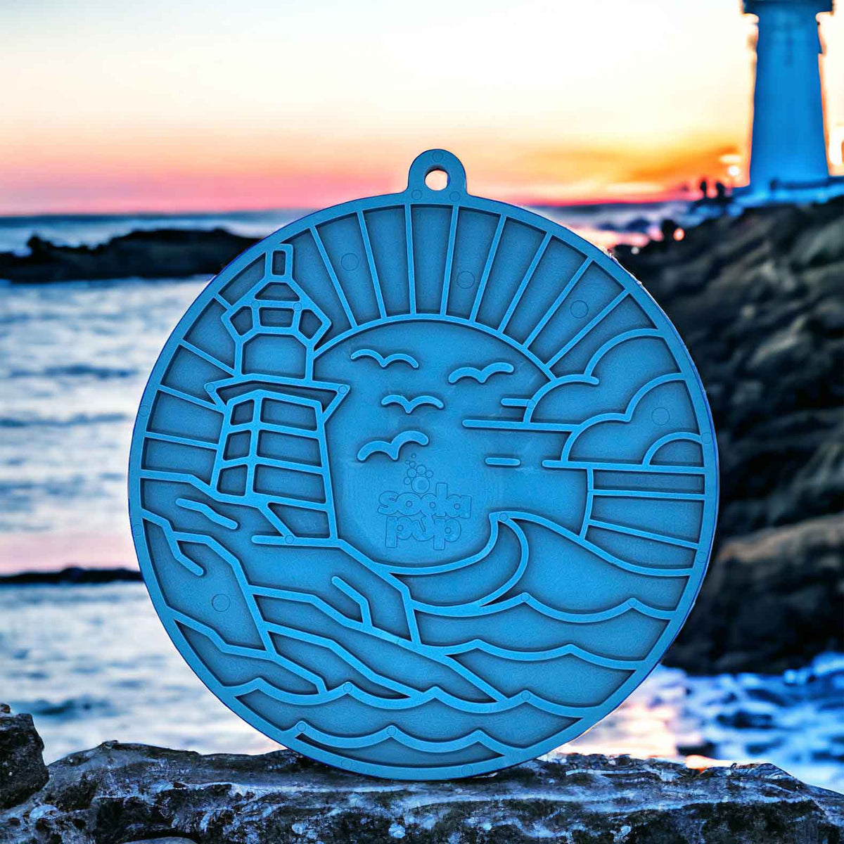 Dark blue lighthouse eMat by SodaPup, top-rack dishwasher safe and freezer safe