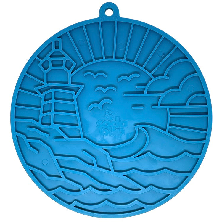 SodaPup Lighthouse eMat lick mat in dark blue with a raised lighthouse and sea scene pattern
