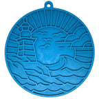 SodaPup Lighthouse eMat lick mat in dark blue with a raised lighthouse and sea scene pattern