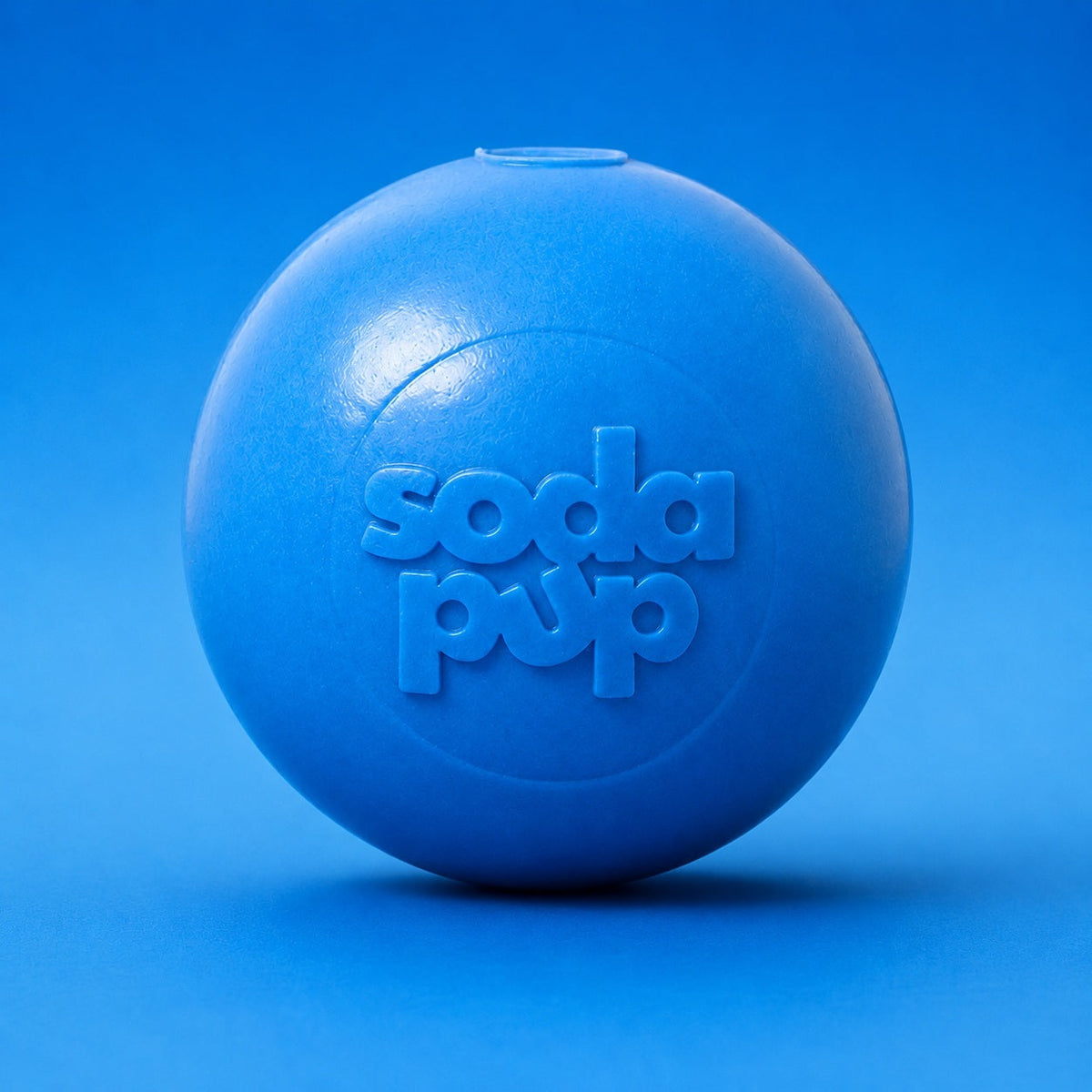 SodaPup Squeak Ball in light blue, a Medium floating squeaky rubber ball for dogs 30 to 65 lb