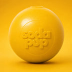 SodaPup Squeak Ball in yellow, a Medium floating squeaky rubber dog ball made in the USA