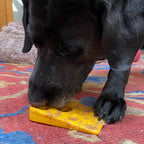 Yellow Swiss Cheese Wedge by SodaPup with holes and indentations for a peanut butter smear
